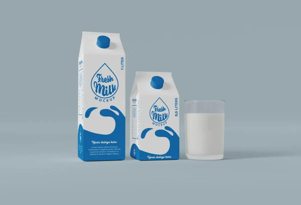 Dwa kartony po mleku (1L i 0,5L) i szklanka mleka. Puste kartony po mleku można wyrzucić do pojemnika na papier.
